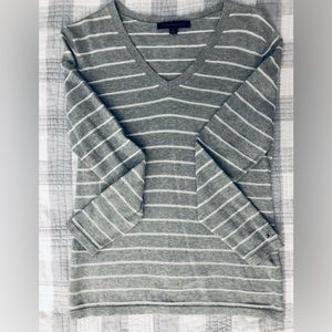 Tommy Hilfiger grey sweater with white stripes. V-neck.